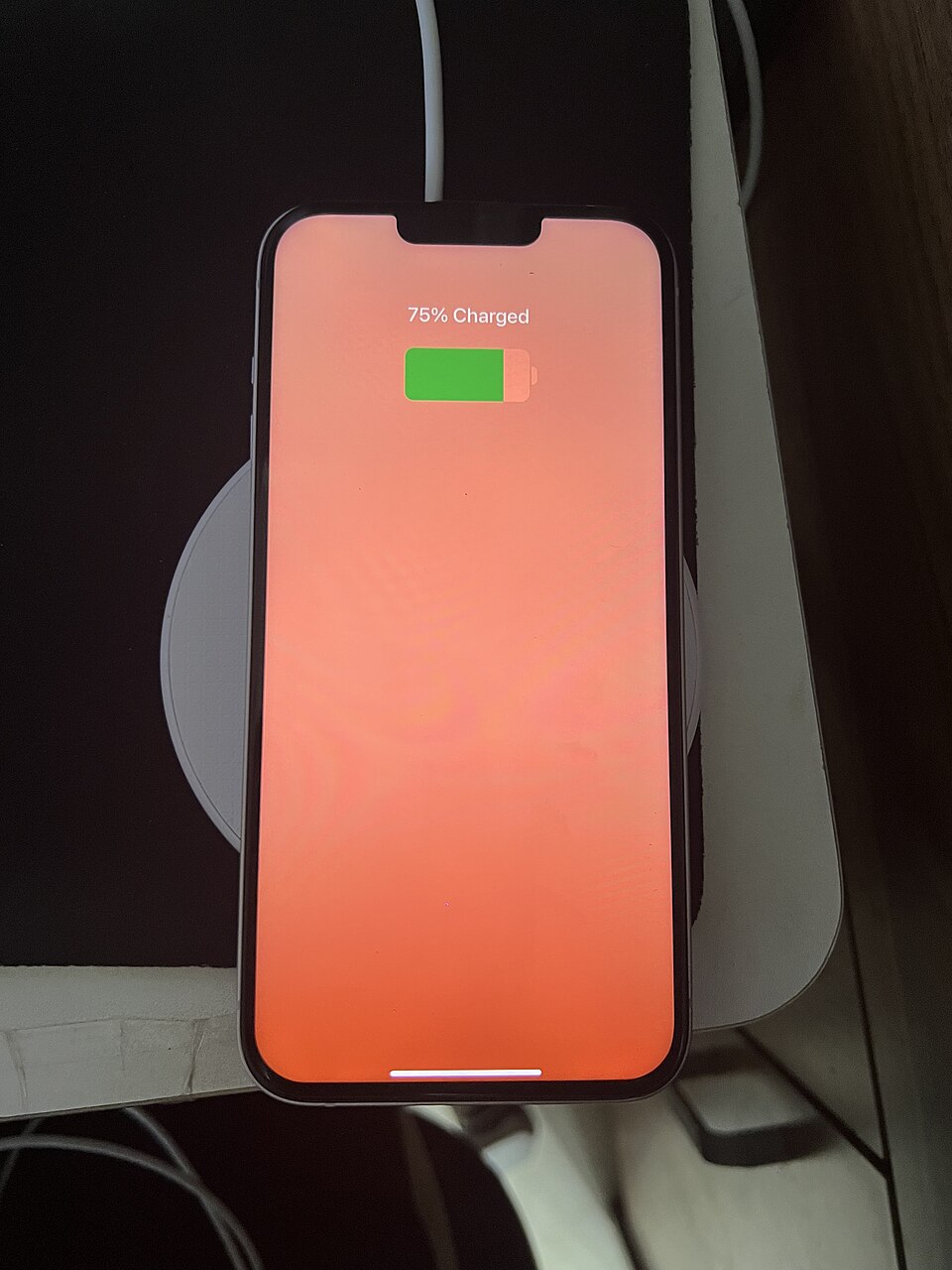 A phone charging on a wireless charging pad